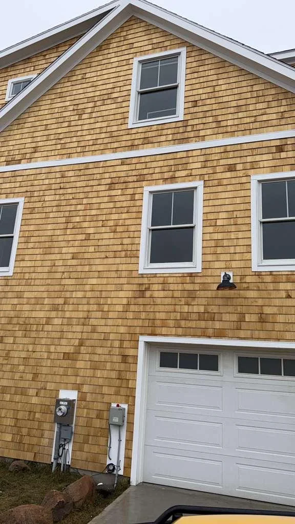 Finished cedar shingle siding and new windows