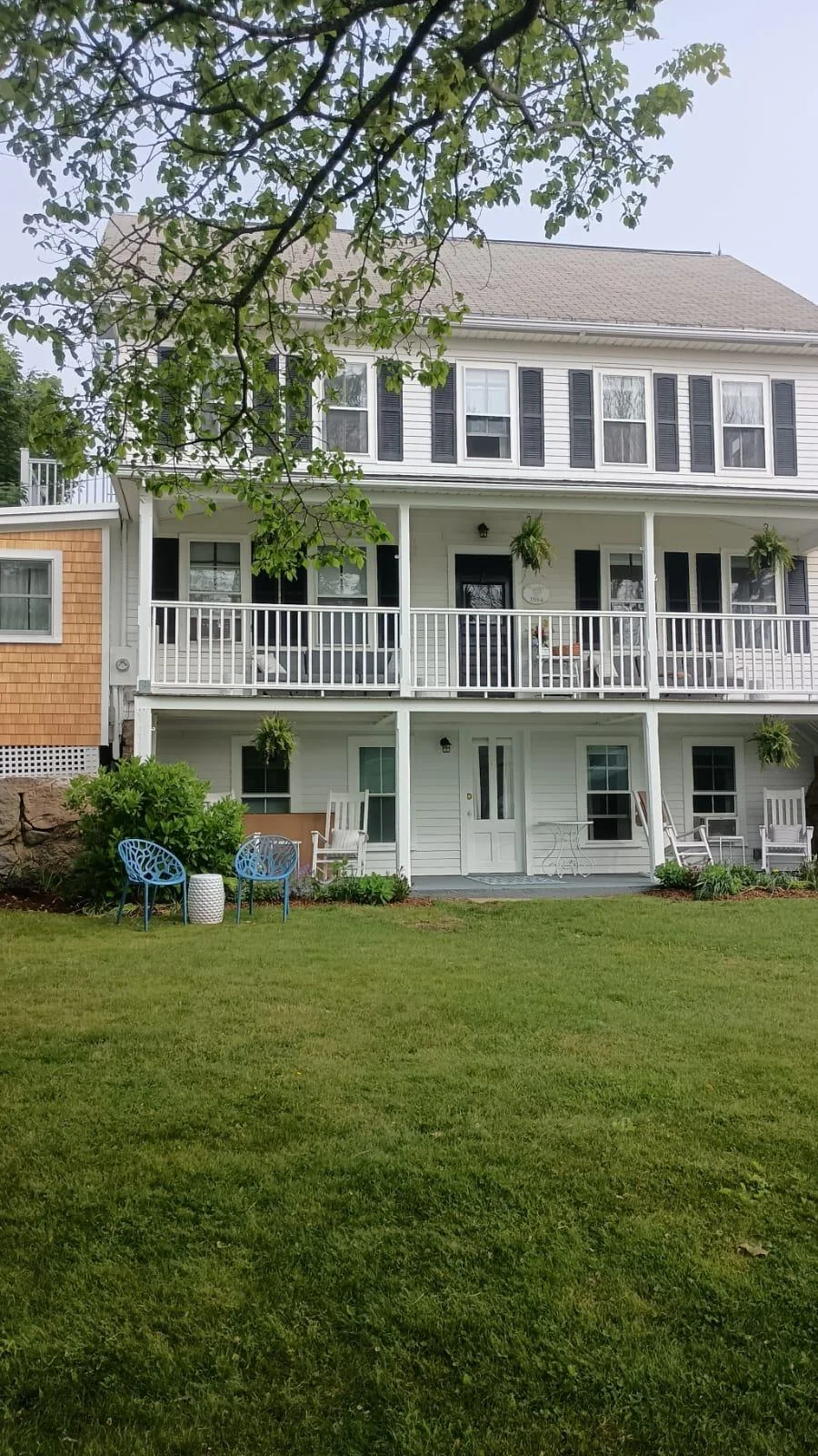 Completed coastal home exterior with porches and decks