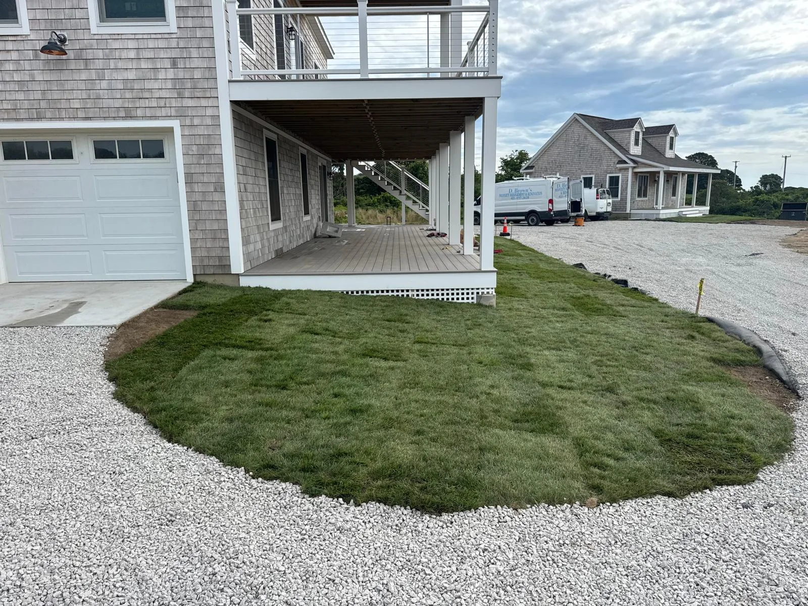 Completed Block Island home exterior and garage approach