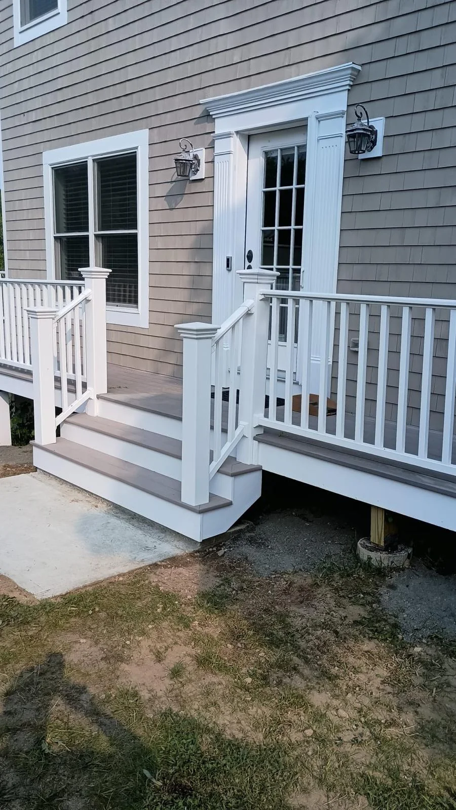 Completed exterior stairs and white railings